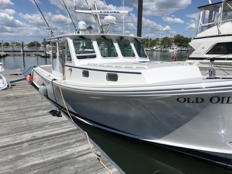 Pilothouse cruiser at the dock