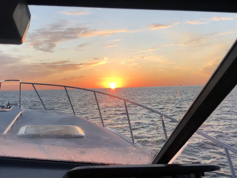 Sunset over the water from the bow