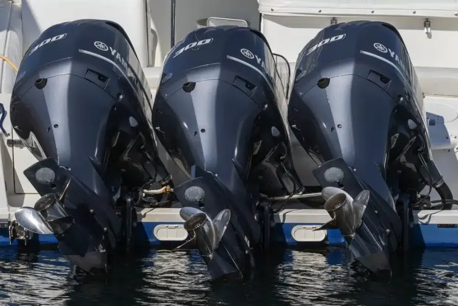 Row of outboard engines on the water